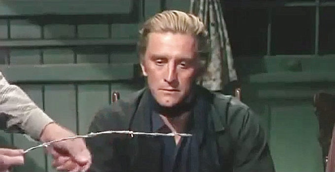 Kirk Douglas as Dempsey Rae, a man who hates barbed wire, in Man Without a Star (1955)