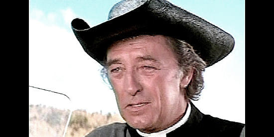 Robert Mitchum as Father Van Horne, a priest with a machine gun and cash in his satchel in The Wrath of God (1972)