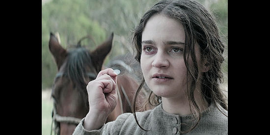 Aisling Franciosi as Claire Carroll, offering a shilling for a gide in The Nightingale (2018)