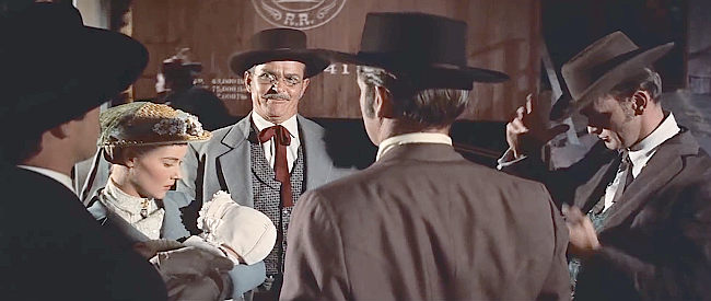 Alan Baxter as Barney Remington, telling the Howard family about his plans for the James gang in The True Story of Jesse James (1957)