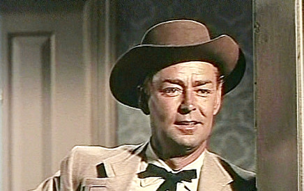 Alan Ladd as Chad Morgan, catching his first glimpse of Helen Jagger in The Big Land (1957)
