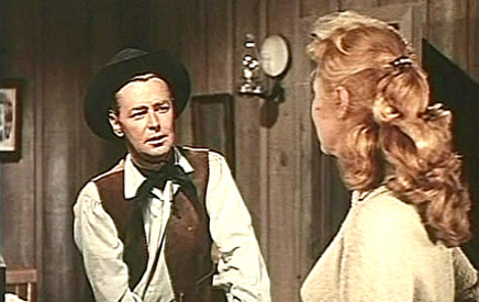 Alan Ladd as Chad Morgan with Virginia Mayo as Helen Jagger in The Big Land (1957)