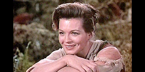 Angie Dickinson as Rose Carver, an indentured servent rescued from forced marriage in Frontier Rangers (1959)
