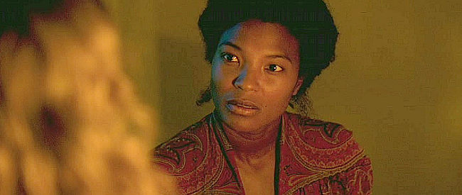Armelle Abibou as Layla, offering to help Esther sort out a nightmare with a bit of voodoo in Savage State (2019)