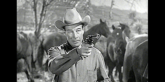 Bill Ellliott as Shadrach Jones, trying to get answers at the point of a gun in The Showdown (1950)