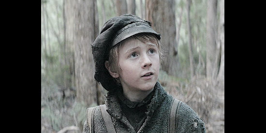 Charlie Shotwell as Eddie, a young boy traveling with Lt. Hawkins in The Nightingale (2018)