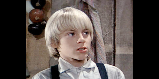 Chuck Pierce Jr. as Joel Rigney, warning his family trouble might be approaching in The Winds of Autumn (1976)