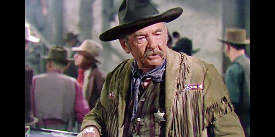 Cliff Barnett as Dan 'Pop' Muzik, the retired sheriff left in charge when Marshal Tyrone rides off with a posse in The Duel at Silver Creek (1952)