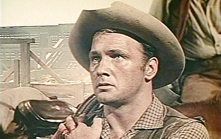 Don Kelly as Billy Tyler, one of the cattleman who feel betrayed by Chad Morgan in The Big Land (1957)