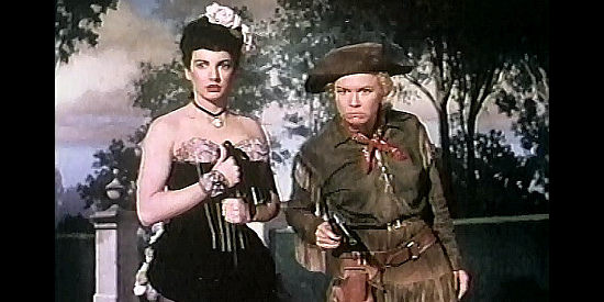 Doris Day as Calamity Jane, convincing a crowd at gunpoint to give Katie Brown (Allyn Ann McLerie) a chance in Calamity Jane (1953)