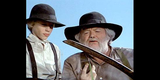 Earl E. Smith as Mr. Pepperdine, helping mentor young Joel Rigney (Chuck Pierce Jr.) in The Winds of Autumn (1976)