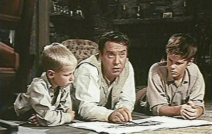 Edmund O'Brien as Joe Jagger shows off hotel plans to Echo (David Ladd) and Olaf (Jake Wrather Jr.) Johnson in The Big Land (1957)