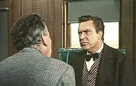 Edmund O'Brien as Joe Jagger with a cattle buyer concerned for his safety in The Big Land (1957)