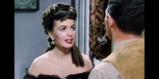 Faith Domergue as Opal Lacy, trying to wrap a marshal around her little finger in The Duel at Silver Creek (1952)