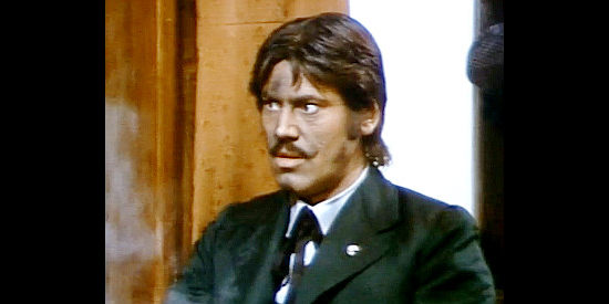 Francesco Ferracini as Mortimer, the rich train passenger who tries to move in on Rosy, until Davy intervenes, in Whiskey and Ghosts (1974)