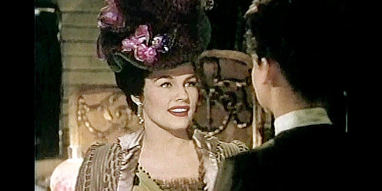 Gale Robbins as Adelaid Adams, questioning Katie's capability as a singer in Calamity Jane (1953)
