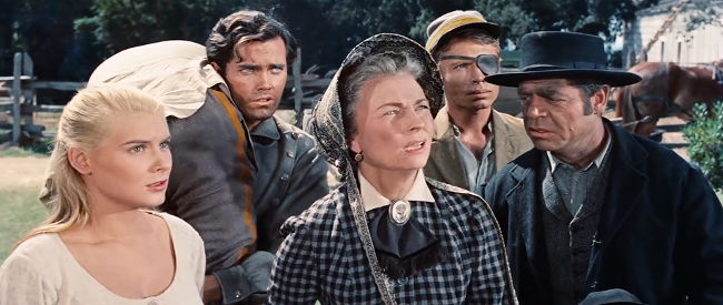 Hope Lange as Zee and Agnes Moorehead as Mrs. Samuel, looking for a place where Jesse can recover from his wounds in The True Story of Jesse James (1957)