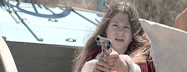 Kacie Borrowman as Little Mary, getting the drop on Dynamite after he kills her brother in No Name and Dynamite (2022)