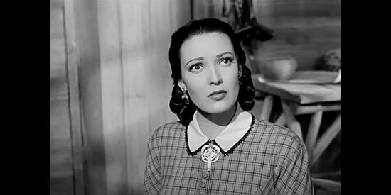 Linda Darnell as Elena Kenniston, realizing the major's obsession with her presence at the fort in Two Flags West (1950)