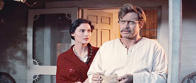 Marian Seldes as Rowena Cobb and Frank Overton as Maj. Rufus Cobb, accepting a dowry for the marriage of Zee in The True Story of Jesse James (1957)