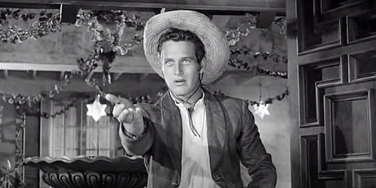 Paul Newman as William Bonney, showing the cartridges he took from Joe Grant's gun in The Left Handed Gun (1958)