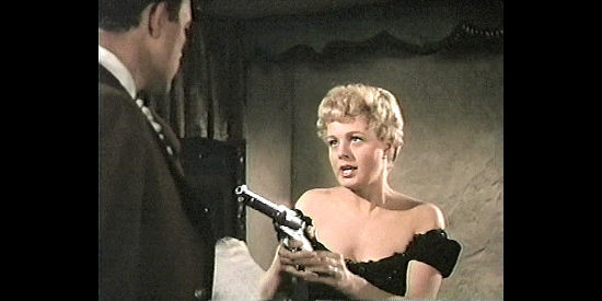 Shelley Winters as Jane Denbow, pulling a six-gun on her new husband in Untamed Frontier (1952)