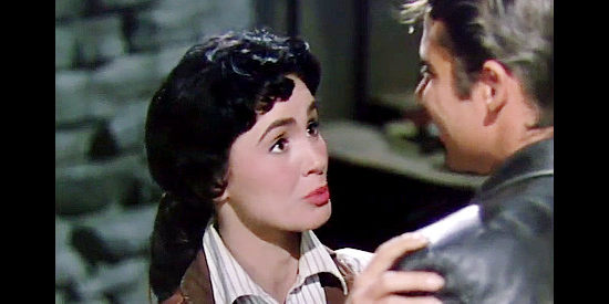 Susan Cabot as Jane 'Dusty' Fargo, deciding it's time to learn The Silver Kid's real name in The Duel at Silver Creek (1952)