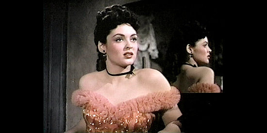 Suzan Ball as Lottie, encourating Glenn Denbow to rustle his own cattle in Untamed Frontier (1952)