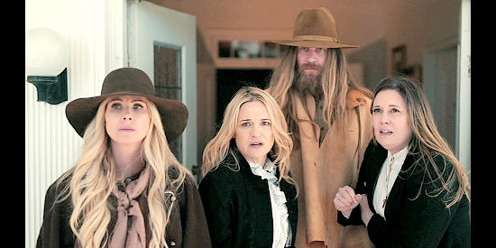 Vanessa Evigan as Leslie Allen, Victoria Pratt as Carol Cassidy and Erin Beathea as Marianne react when Thorn Laron's men, including Thatch (Brock O'Hurn) show up in The Desperate Riders (2022)