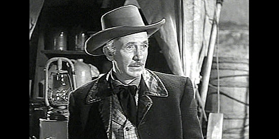 Walter Brennan as Cap MacKellar, the cattleman trying to convince Shadrach to give up his quest for revenge in The Showdown (1950)