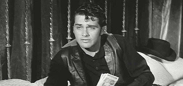 Brett Halsey as Johnny Naco, accepting $3,000 to kill a man who turns out to be his brother in Four Fast Guns (1960)