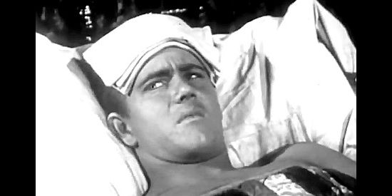 Chuck Courtney as Bill Walton, in bed after accidentally stepping into a gunfight in Born to the Saddle (1953)