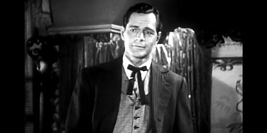 Donald Woods as Matt Daggett, gambler, scoundrel and man being the trouble in Born to the Saddle (1953)