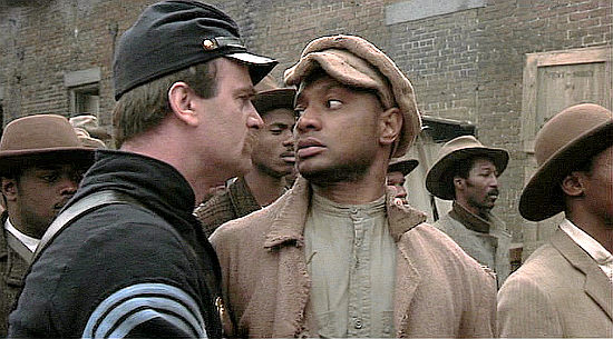 Jihmi Kennedy as Pvt. Jupiter Sharts, leanring left-right the hard way from Sgt. Maj. Mulcahy (John Finn) in Glory (1989)
