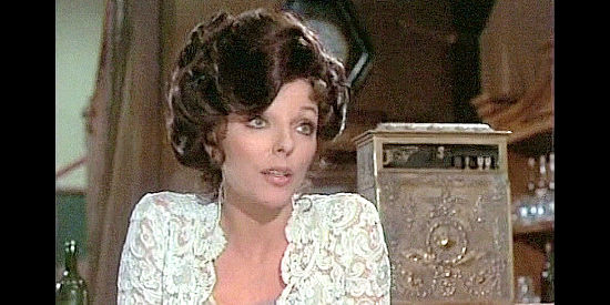 Joan Collins as saloon girl Sonia Kendall, welcoming strangers to Dawson City in The Great Adventure (1975)