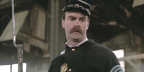 John Finn as Sgt. Maj. Mulcahy, the professional brought in the help train the 54th in Glory (1989)