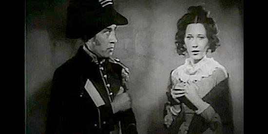 Julian Rivero as Gen. Santa Anna announces his decision to spare Anne Dickinson (Ruth Findlay) in The Heroes of the Alamo (1937)
