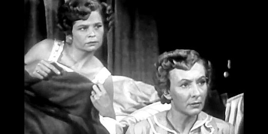 Lucille Thompson as Doris and Karen Morley as Kate Daggett objecting to Tom Roper's rude behavior in Born to the Saddle (1953)