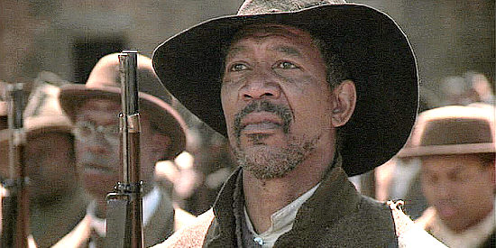Morgan Freeman as Sgt. Maj. John Rawlins, learning blacks will be expected to fight for less pay in Glory (1989)