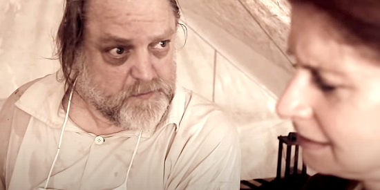 Stan Fink as Doc Henry, breaking bad news to nurse Miss Olivia in American Confederate (2019)