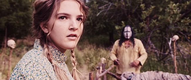 Amelia Haberman as Nellie, Willard's youngest wife, as a medicine man works to reverse the curse in Skinwalker (2021)