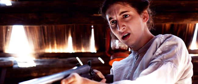 Becky Jo Harris as Clara, baffled by what she's witnessing in Skinwalker (2021)
