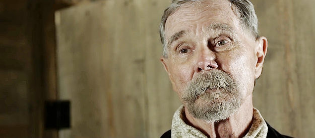 Buck Taylor as Sheriff J.E. Stone, looking for information on the disappearances in Bender (2016)