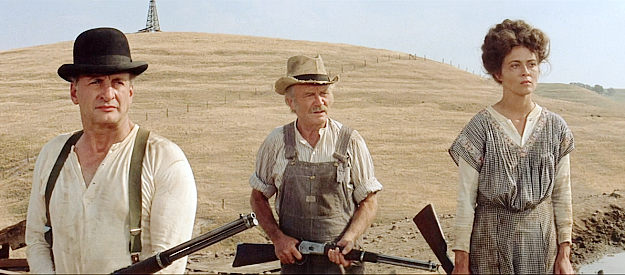 George C. Scott as Mase, John Mills as Cleon and Faye Dunaway as Lena Doyle, ready to defend the land in Oklahoma Crude (1973)