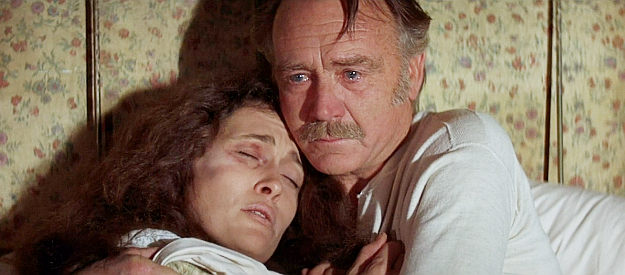 John Mills as Cleon, embracing daughter Lena (Faye Dunaway) after she's been beaten by Hellman's men in Oklahoma Crude (1973)