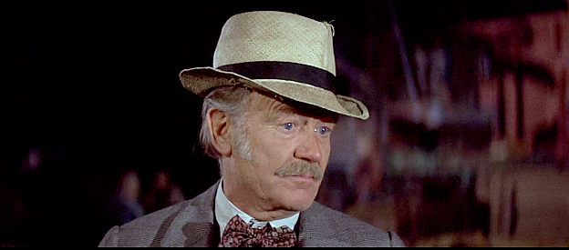 John Mills as Cleon, looking for men willing to help his daughter in Oklahoma Crude (1973)