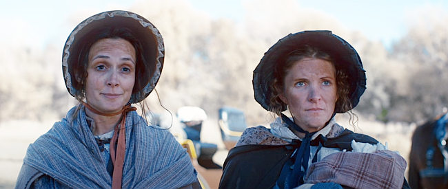 Joseph Smith's wife Emma (Elizabeth Parson) and Hyrum Smith's wife Mary (Charie Julander) arrive at the jail to visit their husbands in Out of Liberty (2019)