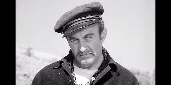 Lee J. Cobb as Capt. Theodore Bess, suspecting trouble from Tinnen in The Tall Texan (1953)