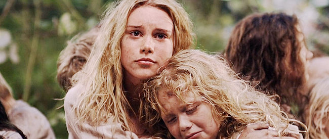 Natalie Racoosin as young Barbara, comforting her sister Regina (Cassie Brennan) shortly after they're captured in Alone Yet Not Alone (2013)