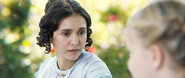 Nina Dobrev as Mae, Sarah's mother, talking to her daughter in Redeeming Love (2022)